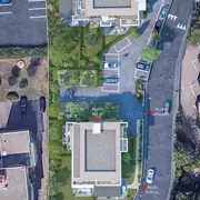 L'organisation prévoit des cheminements dédiés et des parkings sous pergolas végétalisées. Les toitures complètent l'intégration paysagère.