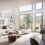 Salon et aéré avec grandes fenêtres, favorisant un espace de vie confortable.