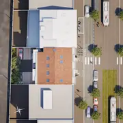 Plan masse montrant les accès piétons, parkings et espaces verts autour de la résidence.