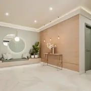 Espaces communs soignés avec sol en grès cérame et mobilier sobre.