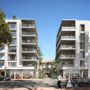 Programme neuf intégrant des espaces commerciaux en pied d'immeuble et une architecture aux lignes épurées.