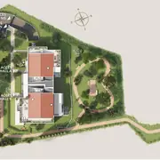 Disposition des bâtiments, chemins piétons, parkings et espaces verts dans le projet.