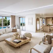 Pièce principale avec mobilier moderne et grande baie vitrée ouvrant sur l'extérieur.