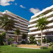 Un jardin intérieur luxuriant offre une bulle de verdure avec des palmiers et des cheminements piétons. Les façades aux courbes douces épousent harmonieusement la nature environnante.